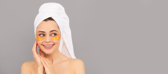 happy girl with terry towel use facial golden eye patch for skin, healthy skin. Beautiful woman isolated face portrait, banner with mock up copy space. - obrazy, fototapety, plakaty