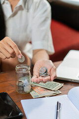 Young woman checking bills, taxes, bank account balance and calculating credit card expenses