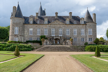Front of Chateau de Kergrist, France. Medieval estate house with normandy turreted towers.