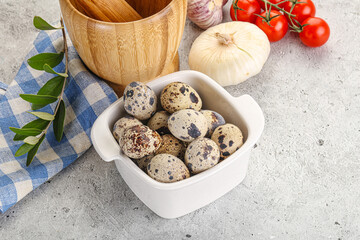 Raw quail eggs in the bowl
