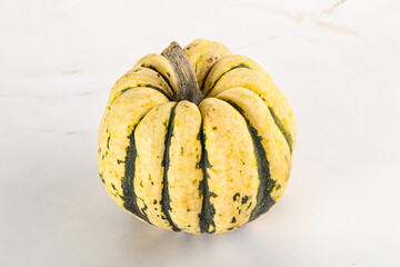 Ripe raw fresh decorative pumpkin
