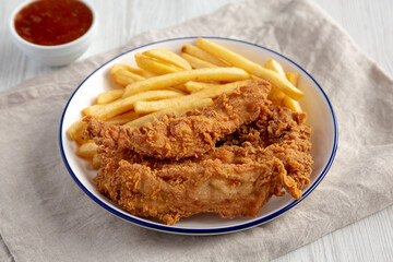 Crispy Chicken Strips with French Fries and Sour-Sweet Sauce