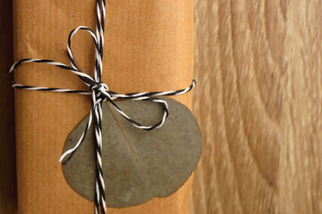 Present wrapped with recycled paper, twine and pressed eucalyptus leaf. Sustainably wrapped...