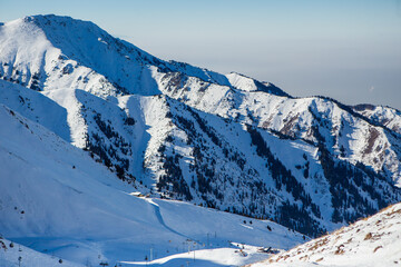 View of the mountains near Shymbulak Ski Resort. Snow Mountains. Almaty. Ile-Alatau National Park. Kazakhstan.