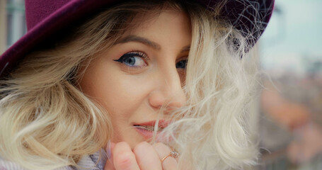 Extreme close up shot blue eyed female posing for magazines. Woman sicking for attention.