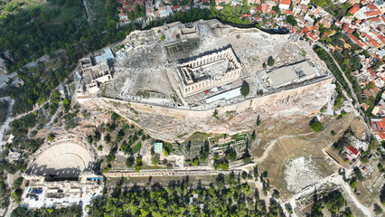 Aerial drone cinematic shot above unique Acropolis hill, the Parthenon, Odeon of Herodus Atticus and theatre of Dionysus, Athens historic centre, Attica, Greece