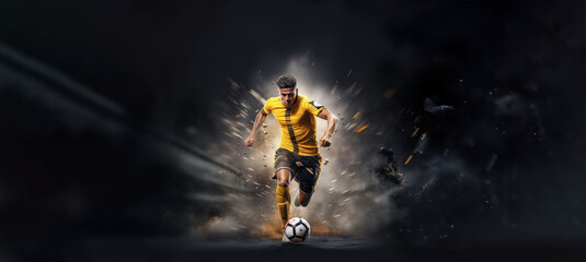 football or soccer player running fast and kicking a ball while training at dramatic stadium shot, dynamic active pose of skill development success in sports championship wide banner - obrazy, fototapety, plakaty