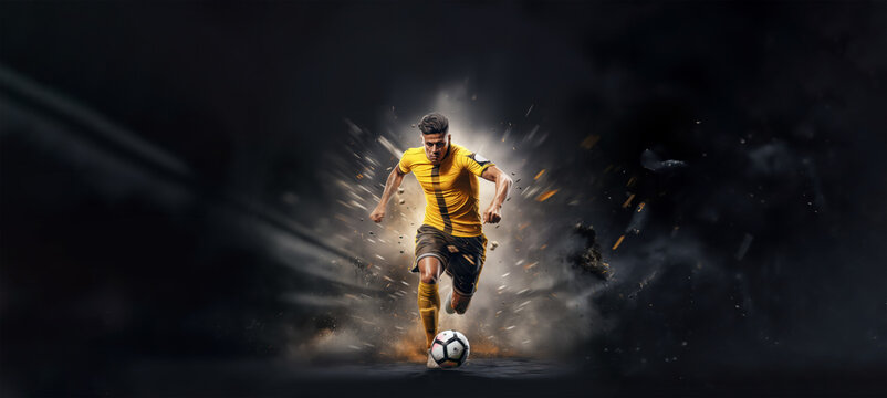 Fototapeta football or soccer player running fast and kicking a ball while training at dramatic stadium shot, dynamic active pose of skill development success in sports championship wide banner