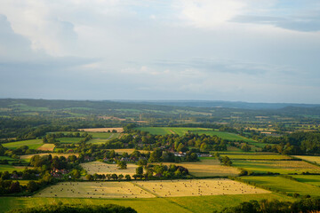 Looking at a sunset on countryside and farm fields