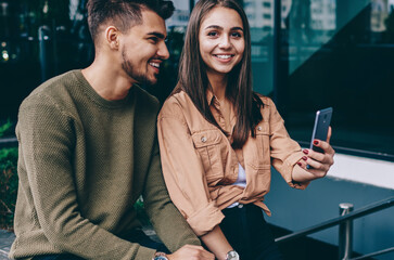 romantic couple feeling happiness together on free time using smartphone camera making selfie