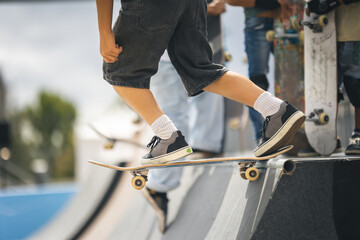 Close-up of skateboarder's foot on board.