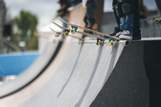Skater sliding down a metal rail.