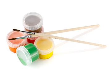 Gouache in a jar.  Jars gouache paints with paint brush on white background isolation. Artistic...