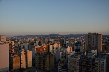 Aerial view of the skyline of the central area of Porto Alegre at sunset - clear sunset sky with few clouds