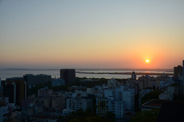 Aerial view of the central area of Porto Alegre with the Guaiba River in the background - clear sky sunset
