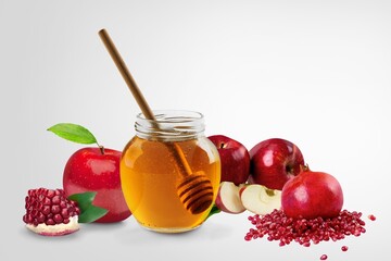 Fresh apples, ripe pomegranates and honey