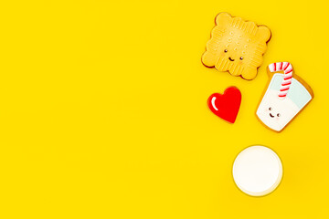Funny cookies in shape of milk in glass and biscuit, top view