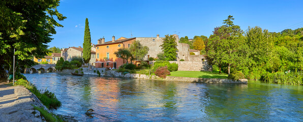 Fototapeta na wymiar Beautiful impressions in the mill village of Borghetto on the river Minico, in the south of Lake Garda, in Veneto, Italy.