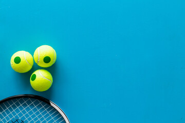 Close up of tennis racquet and balls, top view. Sport games background