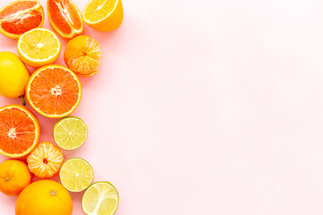 Freah fruits layout. Oranges grapefruits limes and other citrus fruits, top view