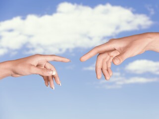 Two hands try to touch fingers. Elegant gesture