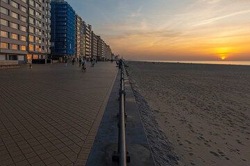 Waterfront promenade and apartment buildings at sunset in Ostend, West Flanders, Belgium.