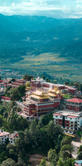 Aerial view of the Thrangu Tashi Yangtse Monastery or Namo Buddha Monastery is a Tibetan Buddhist monastery, close to Kathmandu, it lies at the top of the hill. Nepal 10-03-2023