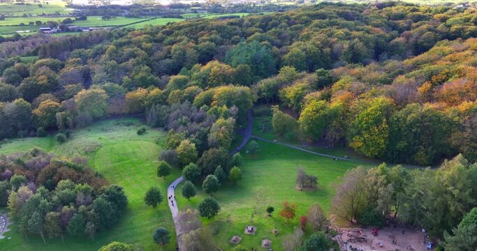 Aerial video of Tandle Hill country Park in Greater Manchester during the season of Autumn