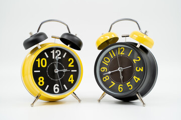 Yellow black table alarm clock on white background isolated.