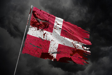 Denmark torn flag on dark sky background with blood stains.
