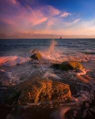 
sunset beach rocks waves