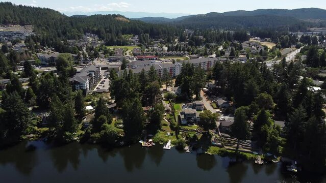 Aerial new condo development overlooking Glen Lake and distant Olympic Mountains in Washington State USA.
