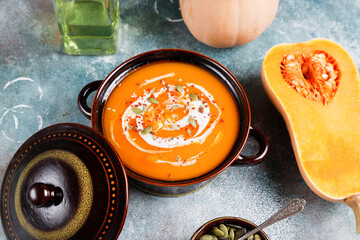 Traditional autumn butternut squash soup with seeds.