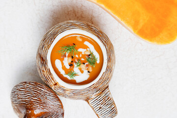 Traditional autumn butternut squash soup with seeds.