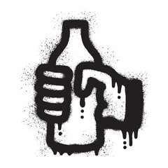 hand holding a bottle with black spray paint