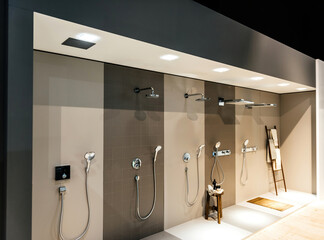 multiple types of showers - presentation inside a modern showrioom for bathroom appliances and...