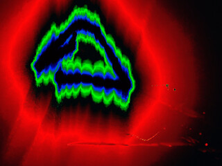 Glowing triangle. A geometric figure is hand-drawn with colored neon lines on a black background. The black triangle glows blue-green at the edges, with a red halo around it.