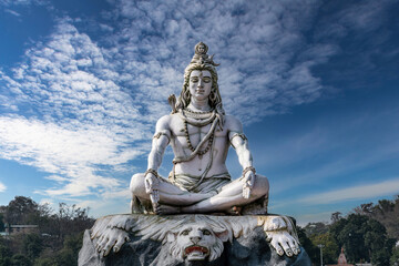 Shiva statue on the banks of the sacred Ganges River in Rishikesh, India.