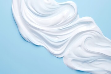 White cosmetic cream lotion moisturizer strokes on blue background - obrazy, fototapety, plakaty
