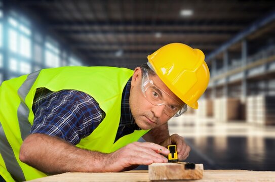Carpenter man at work in factory workplace, AI generated image