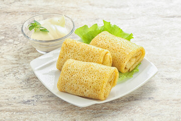 Stuffed pancakes with meat and cream