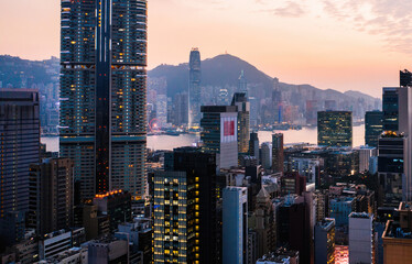 Aerial scenery panoramic view of Hong Kong Evening with metropolitan bay Victoria Harbor at sunset. - obrazy, fototapety, plakaty
