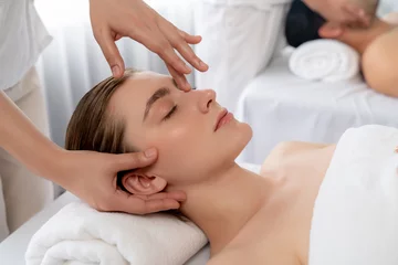 Deurstickers Caucasian couple enjoying relaxing anti-stress head massage and pampering facial beauty skin recreation leisure in dayspa modern light ambient at luxury resort or hotel spa salon. Quiescent © Summit Art Creations