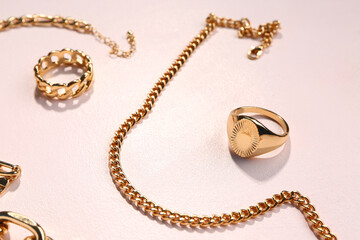 Beautiful golden jewellery on white background