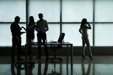 Silhouette of business consultants working in office