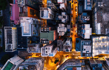 Aerial top view of downtown district buildings in night city light.