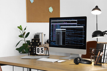 Programmer's workplace with computer in office