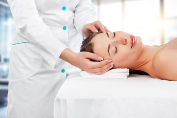 Obraz na płótnie Canvas Shot of a young beautiful woman enjoying massage at salon, AI generated image