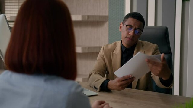 African American businessman and businesswoman at office meeting male employer reject business offer decline financial documents refuse to unemployed client no answer job interview negative decision
