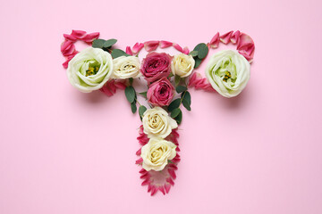Uterus made of beautiful flowers on pink background
